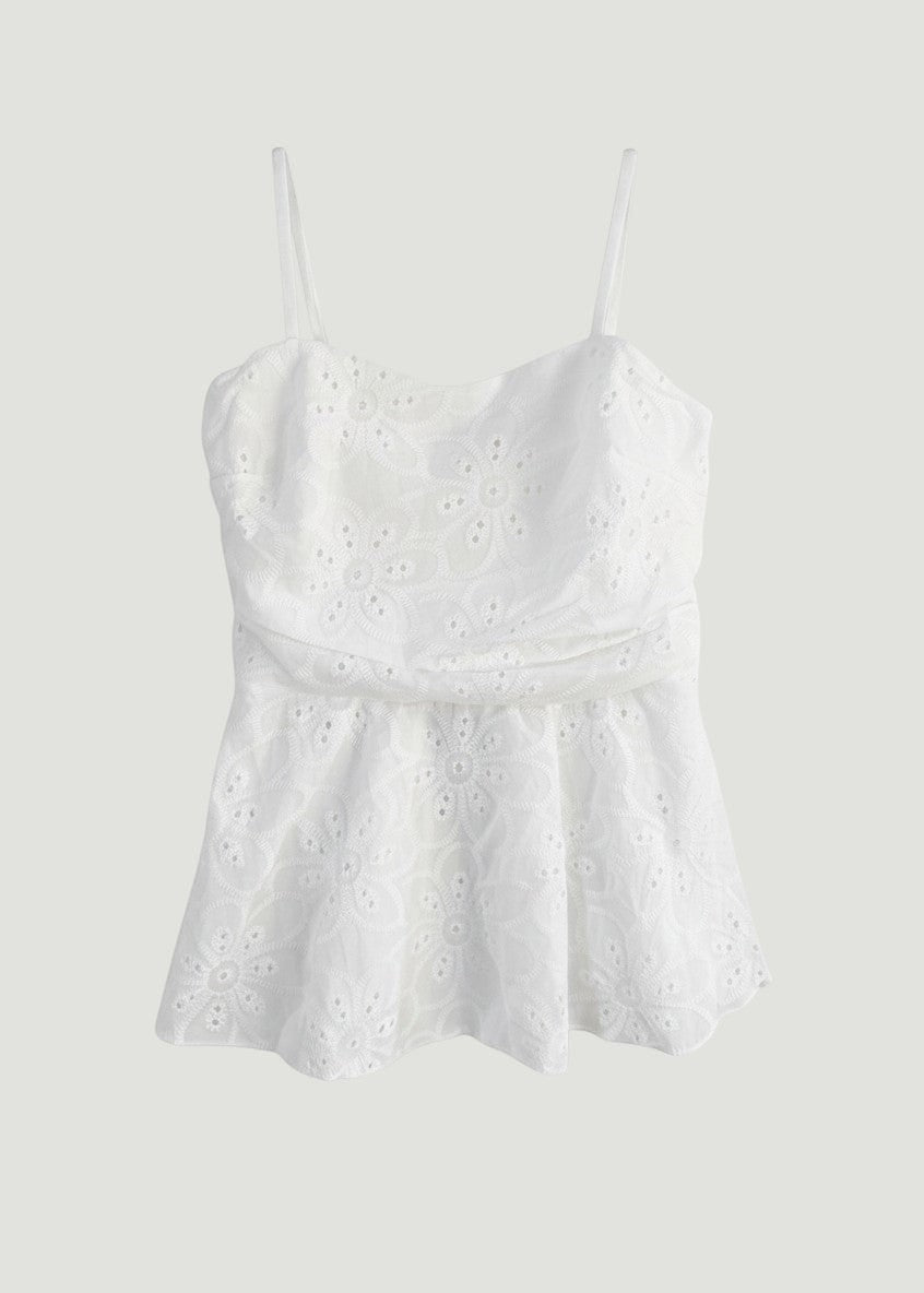 Top blanco tipo corsé peplum de A F R A A T E L I E R en algodón con encaje bordado de motivos florales