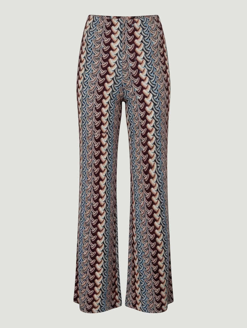 Pantalones wide leg A F R A A T E L I E R con estampado étnico en tonos azul, burdeos, beige y mostaza.