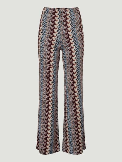Pantalones wide leg A F R A A T E L I E R con estampado étnico en tonos azul, burdeos, beige y mostaza.